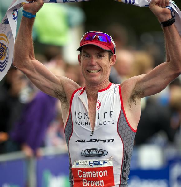 Cameron Brown celebrates victory in today's Port of Tauranga Half at Mount Maunganui